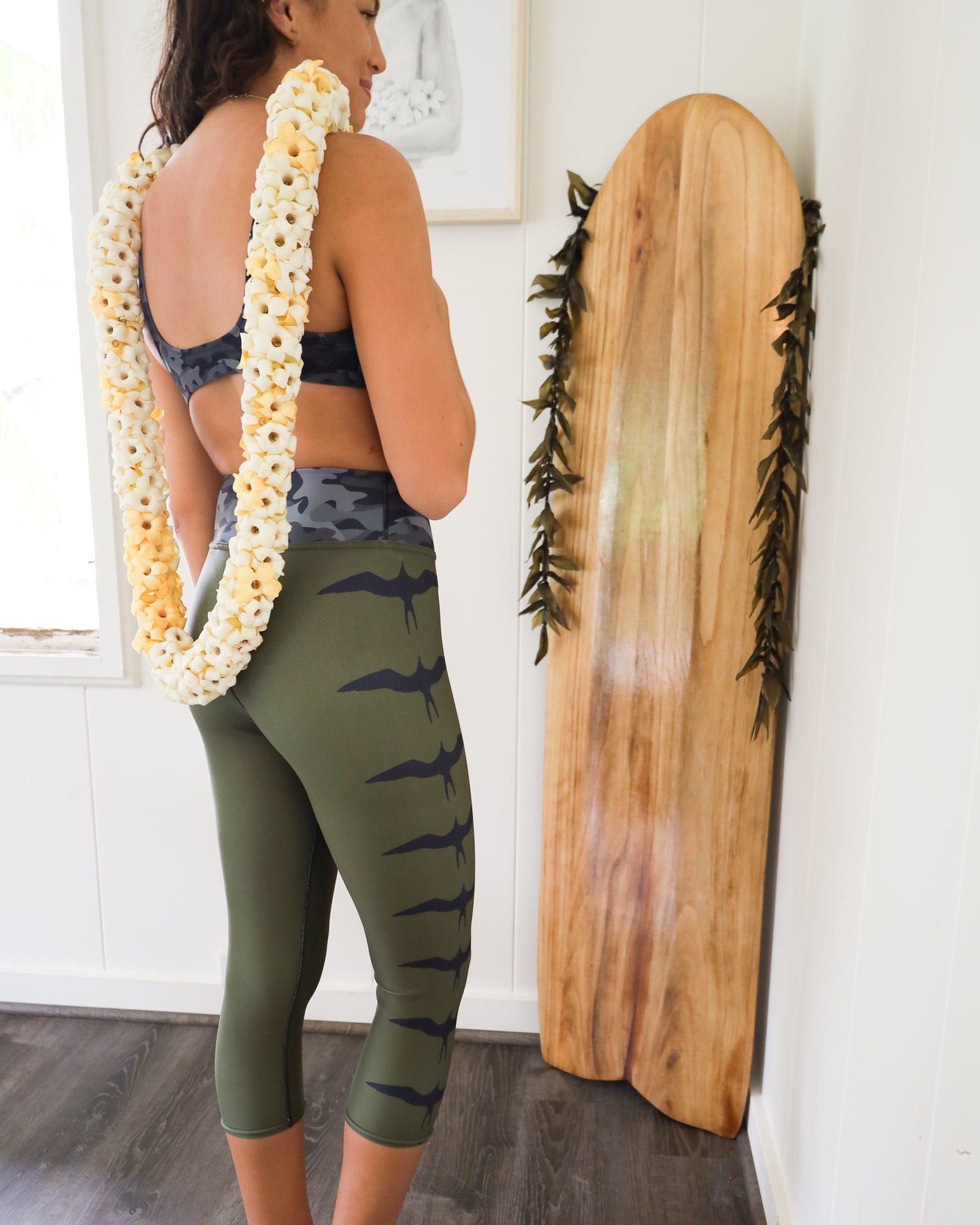 https://onepaahawaii.com/cdn/shop/products/wahine_womens_leggings_swimwear_olive_green_iwa_surf_paddle_puakenikeni_lei_local_business_onepaa_hawaii_6_1800x1800.jpg?v=1654234994